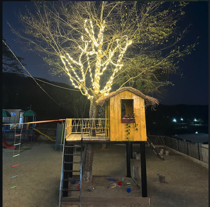 Treehouse at night with fairy lights